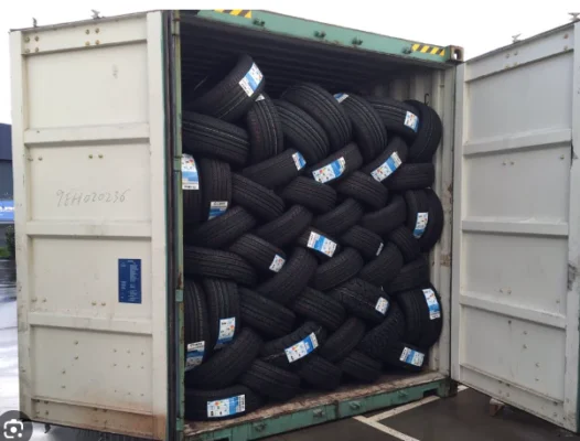 bulk brand tires stacked in export warehouse ready for container loading